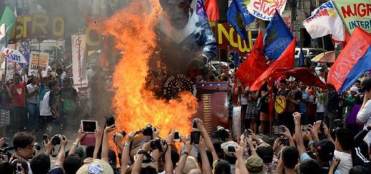 Filipino protesters burn an effigy of US President Barack Obama